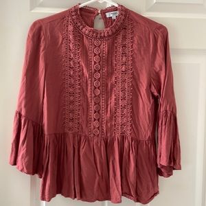 Burnt Sienna blouse with bell shaped sleeves and pleated decorative front. NWOT